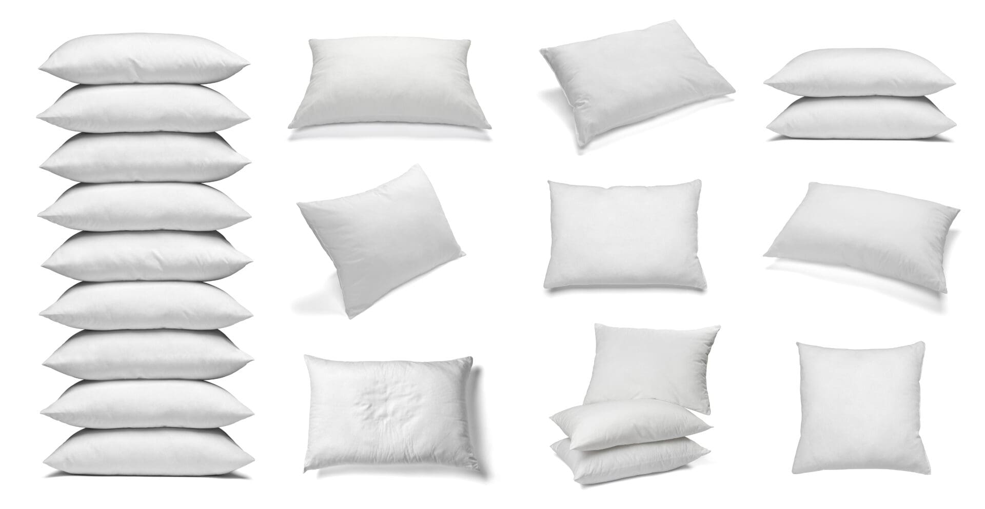 A set of eight different white pillows.